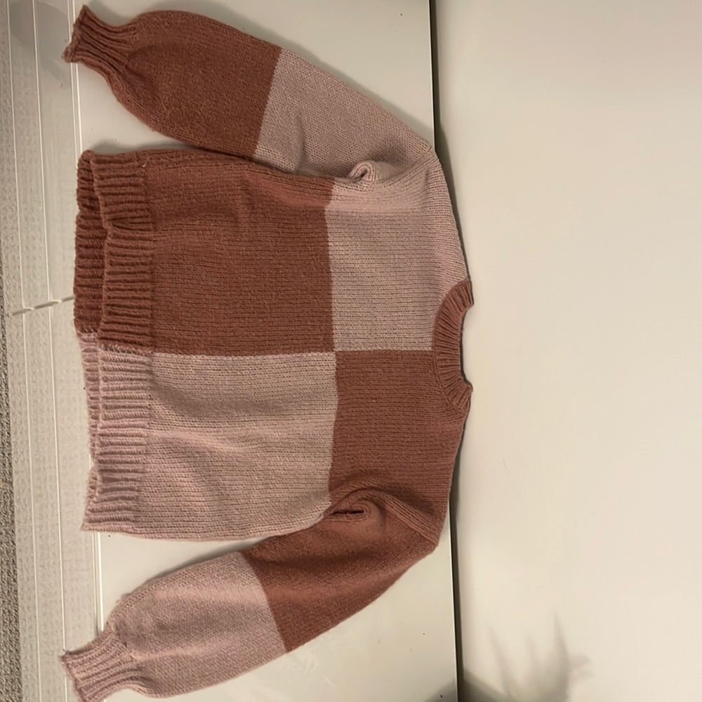 light and dark pink sweater.